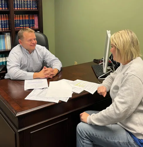 Attorney Timothy C. Bates meets with a client
