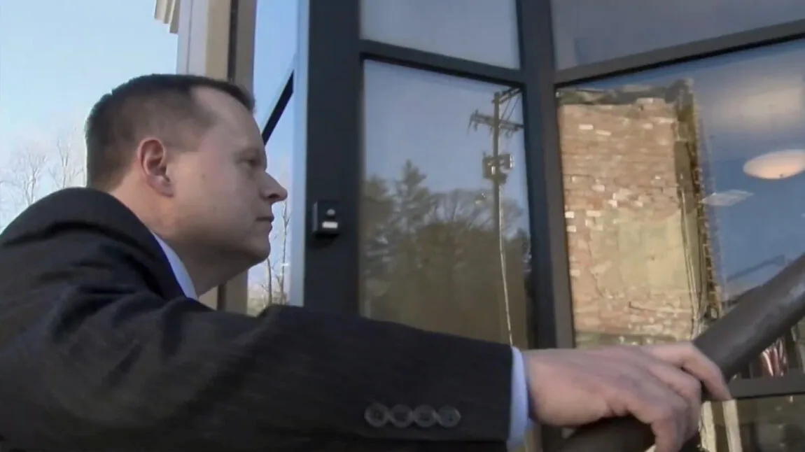 Attorney Timothy C. Bates enters a court house